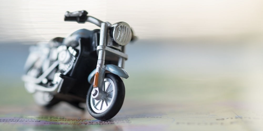 Close-up of motorcycle toy on map